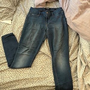 Dark blue jeggings, very stretchy and breathable.